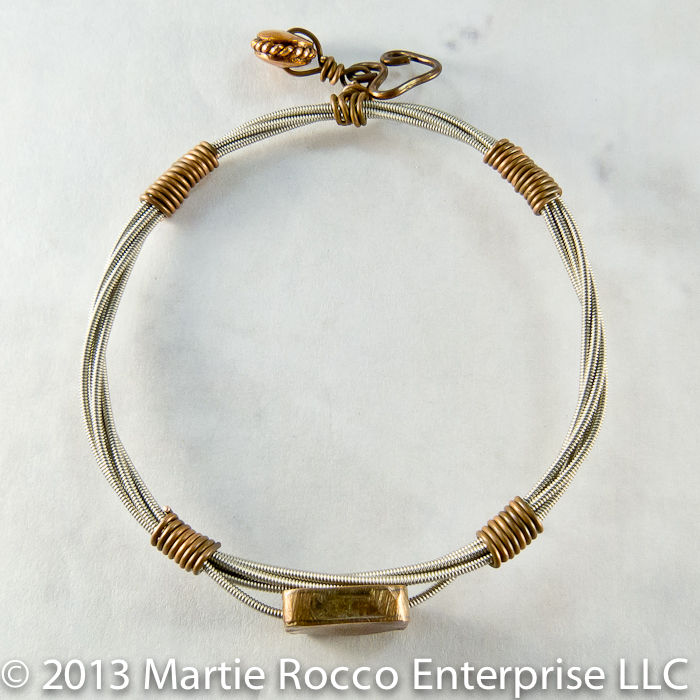 Guitar String bangle bracelet with copper focal bead and wire wrap