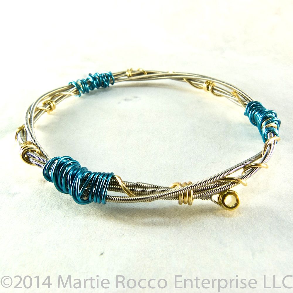 guitar string bangle bracelet double coiled brass and blue wire wrap