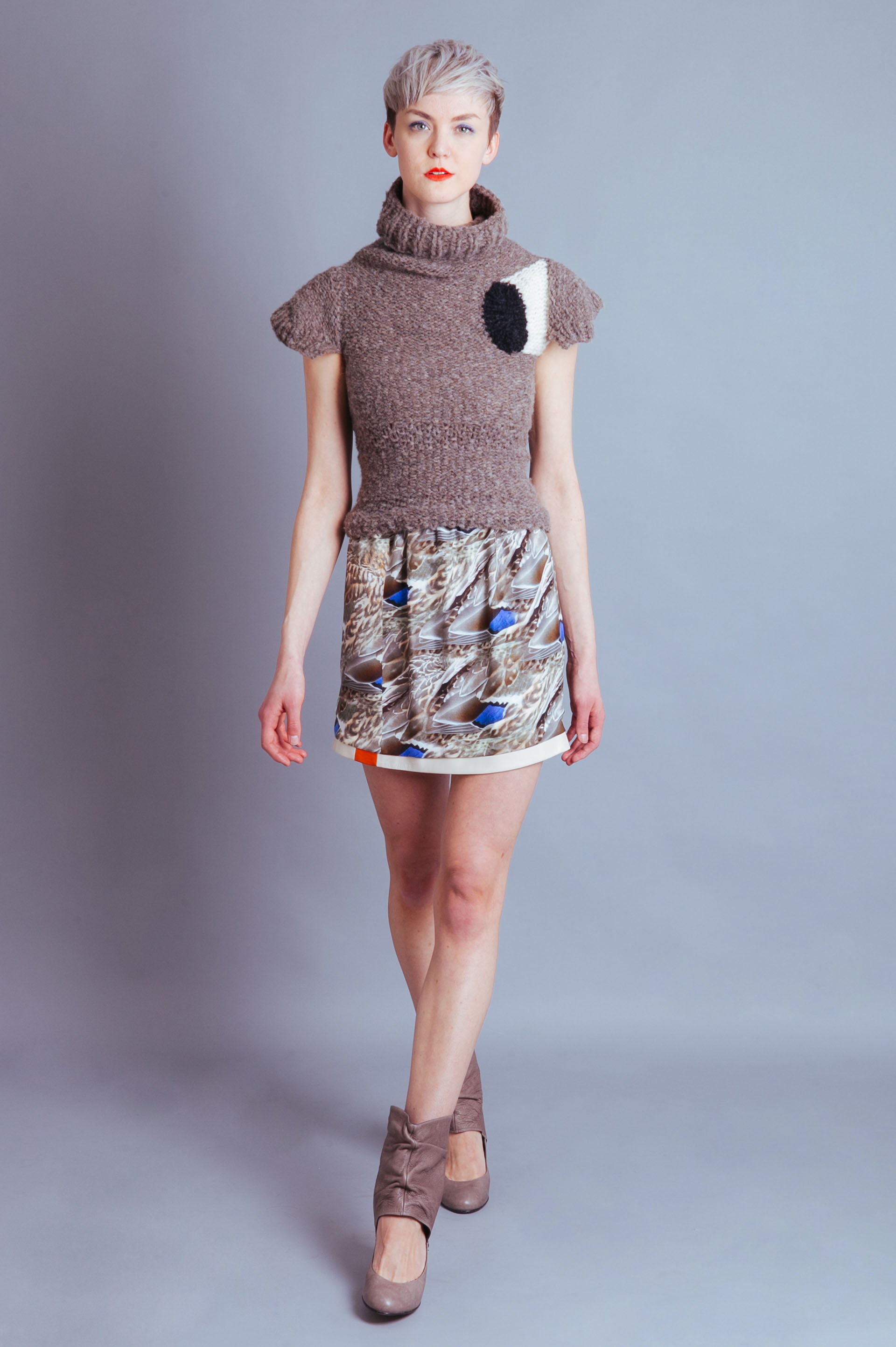 Claire Andrew luxury womenswear designer | Monochrome taupe high neck knit sweater with feather print skirt | Perfect for weekend brunch