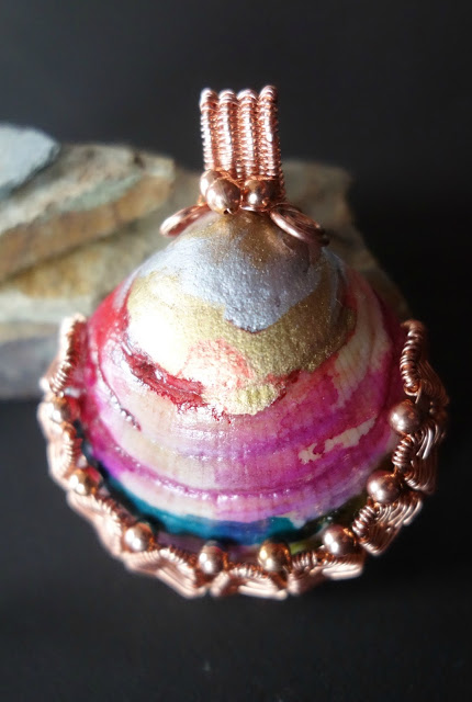 An alcohol ink painted seashell fronm the shores of france