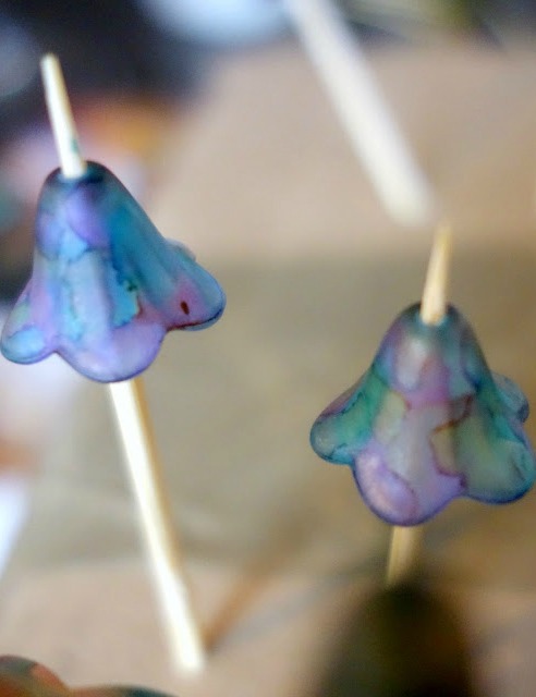 two lucite flower beads painted with alcohol inks to use with wire wrapped earrings