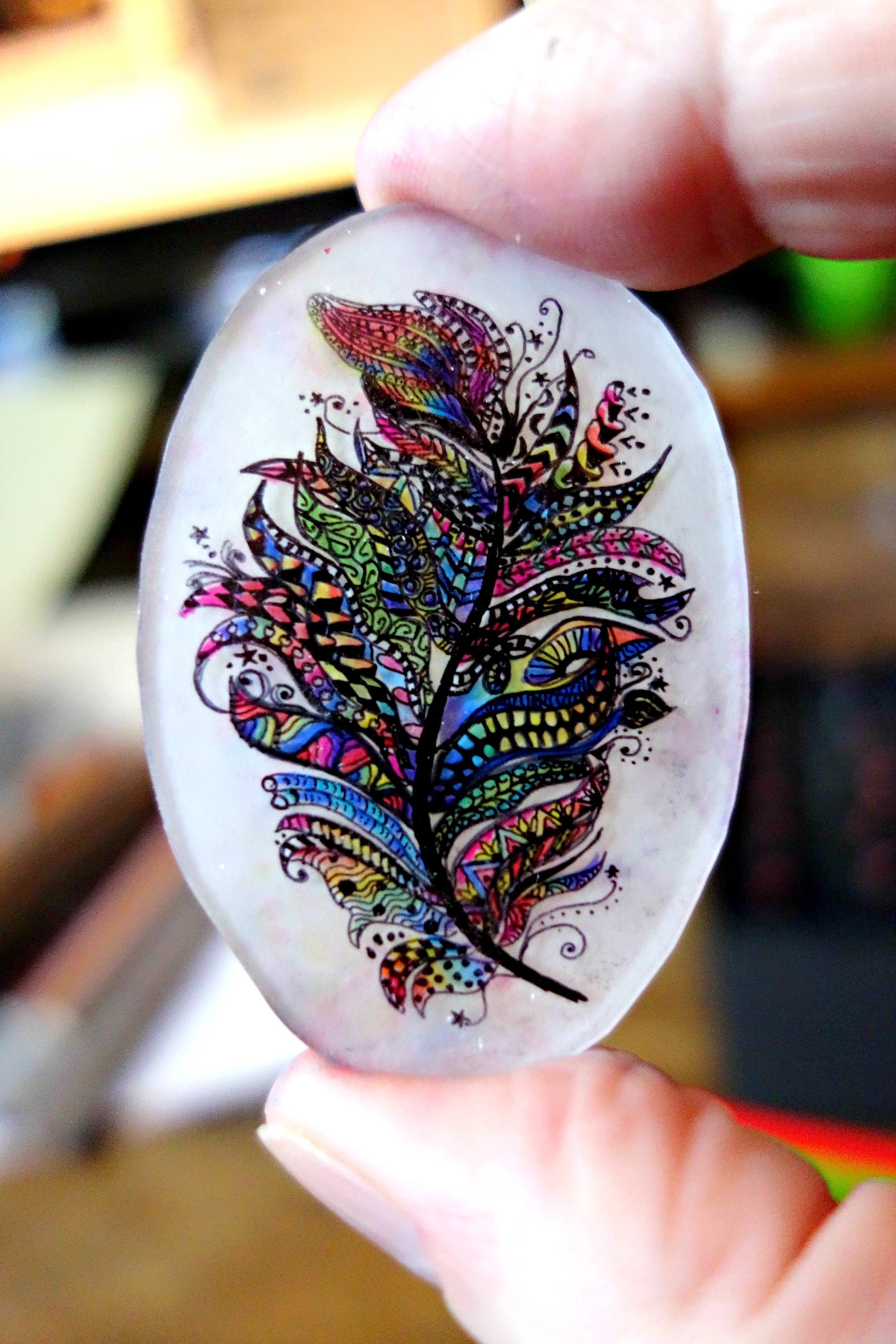 Hand Inked rainbow feather shrink fil pendant cabachon blog post experiment
