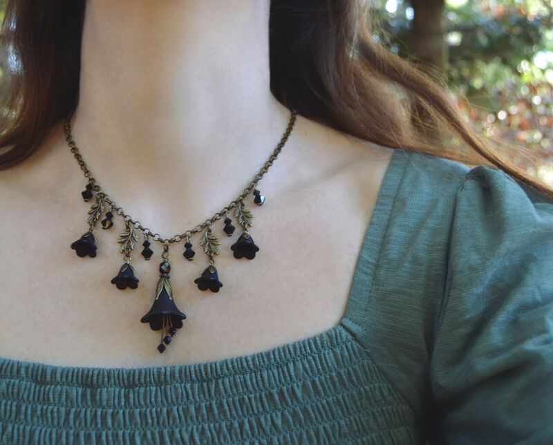 Black Flower Necklace with Crystal Pendants and Leaves on a