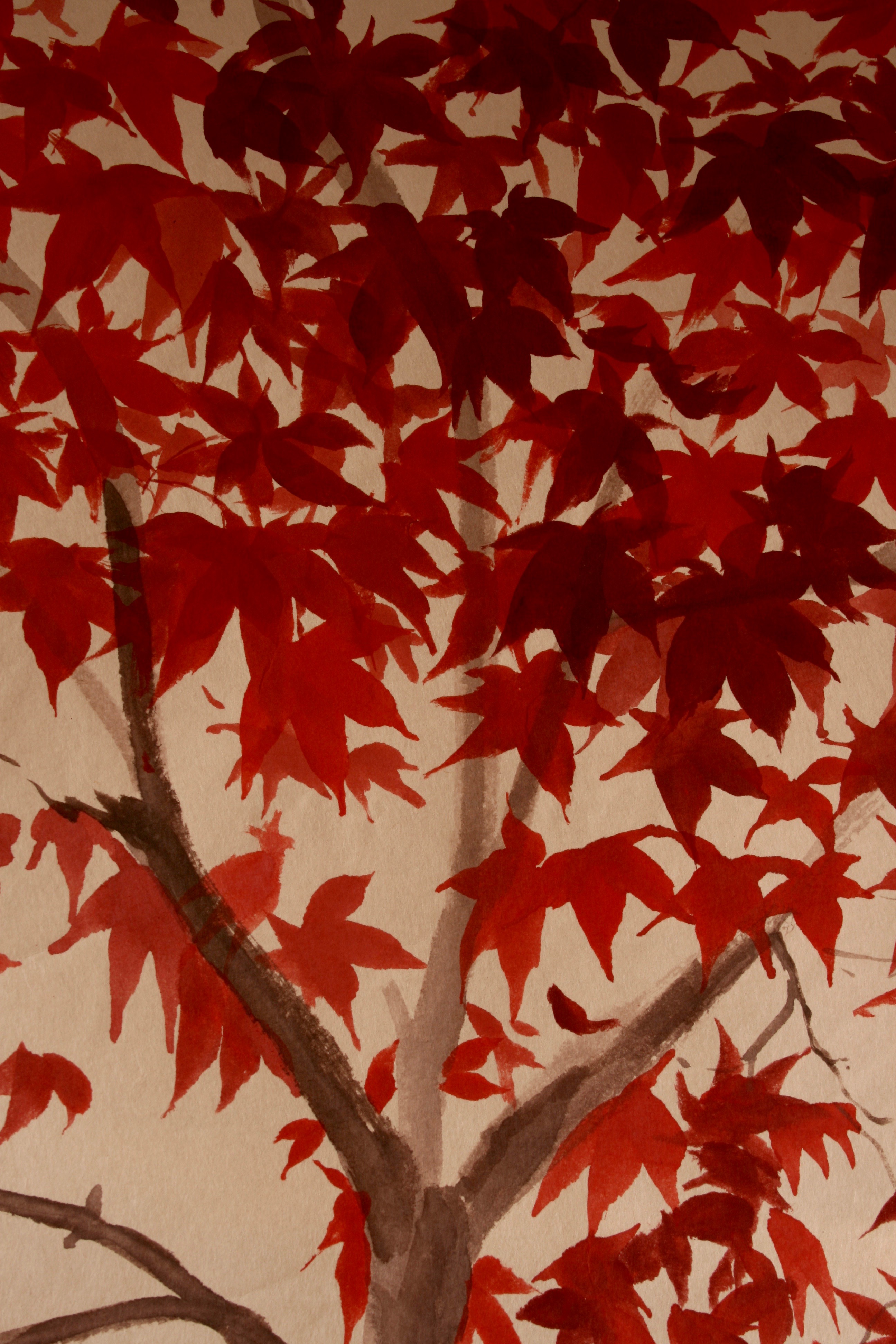 Starburst of brilliant red leaves on handmade Yuumashi paper.