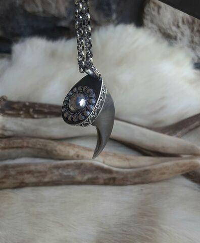 Genuine,bear,claw,and,sterling,silver,talisman