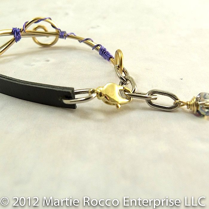 Guitar string bracelet brass Treble clef, lavender wire wrap, leather