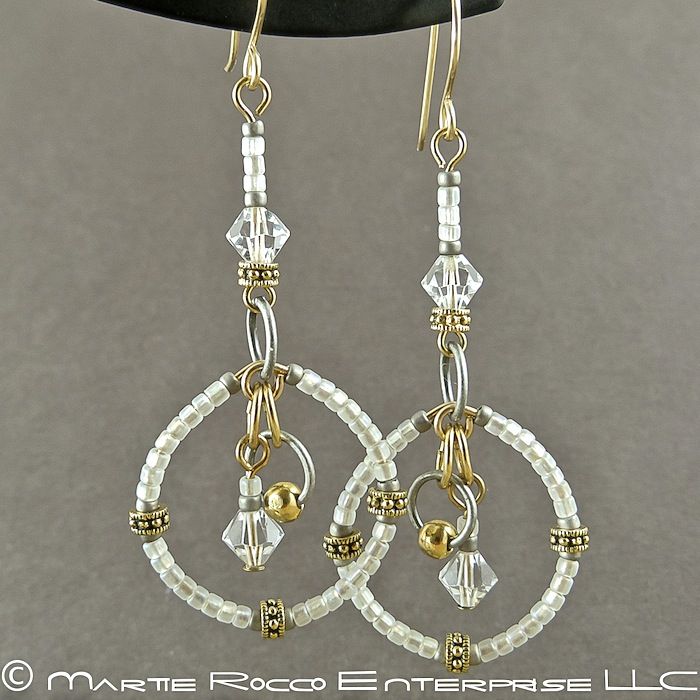 Long white round hoop earrings in seed beads and crystals. - product images  of 