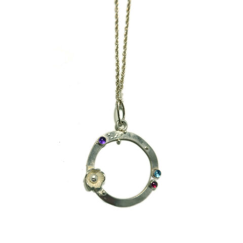Hollow,Circle,Pendant,by,Catherine,Marche,multi gemstone necklace, round circle pendant, coloured gemstone pendant, evening necklace sterling silver, multicolour gemstone jewellery, floral circle pendant, elegant everyday necklace