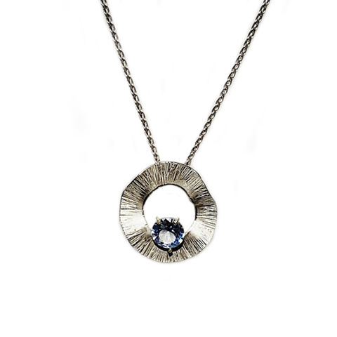 Sunray,necklace,silver,&,blue,by,Shirani,Fernando,Shirani Fernando, silver textured circle pendant with blue spinel