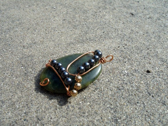 Wire Wrapped Green Polished Stone with Hematite and Gold Toned Bead Accents - product images  of 