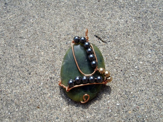 Wire Wrapped Green Polished Stone with Hematite and Gold Toned Bead Accents - product images  of 