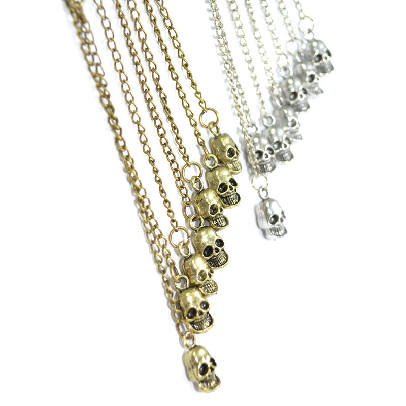 CHAIN AND SKULL CHARMS EAR CUFF - product image  