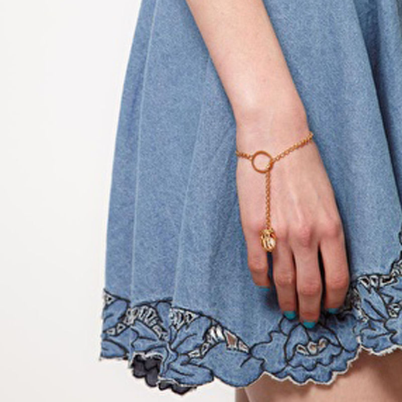 GOLD TONE TALON WITH PEARL BRACELET - product image  