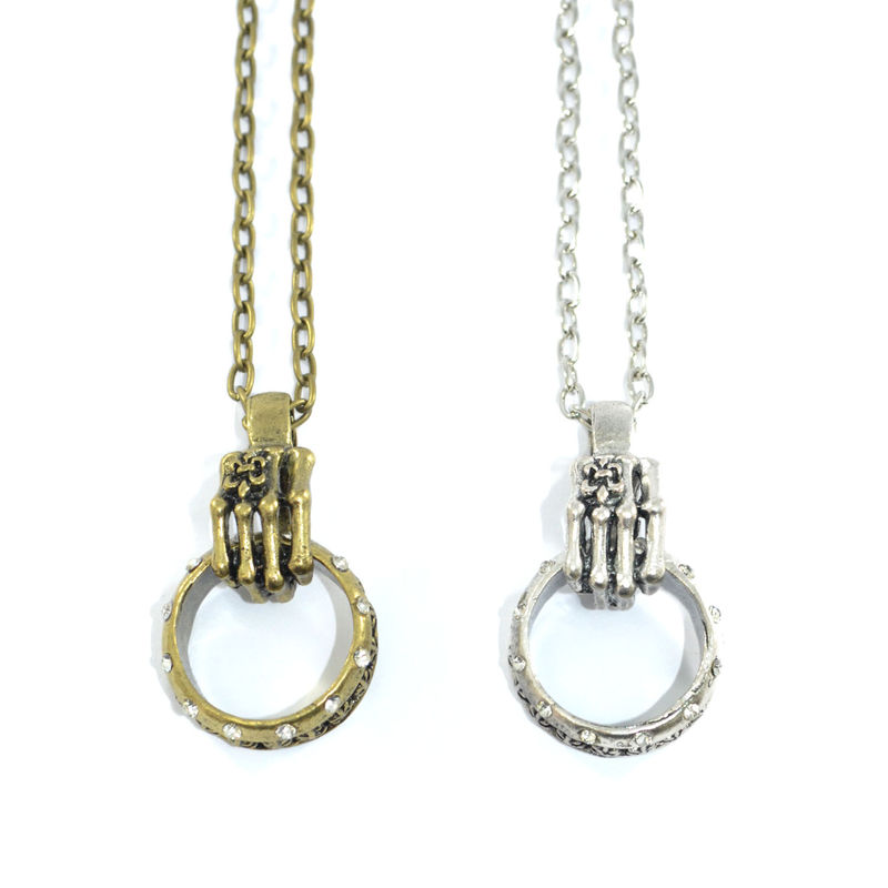 VINTAGE SKELETON HAND WITH RATTLE NECKLACE - product image  