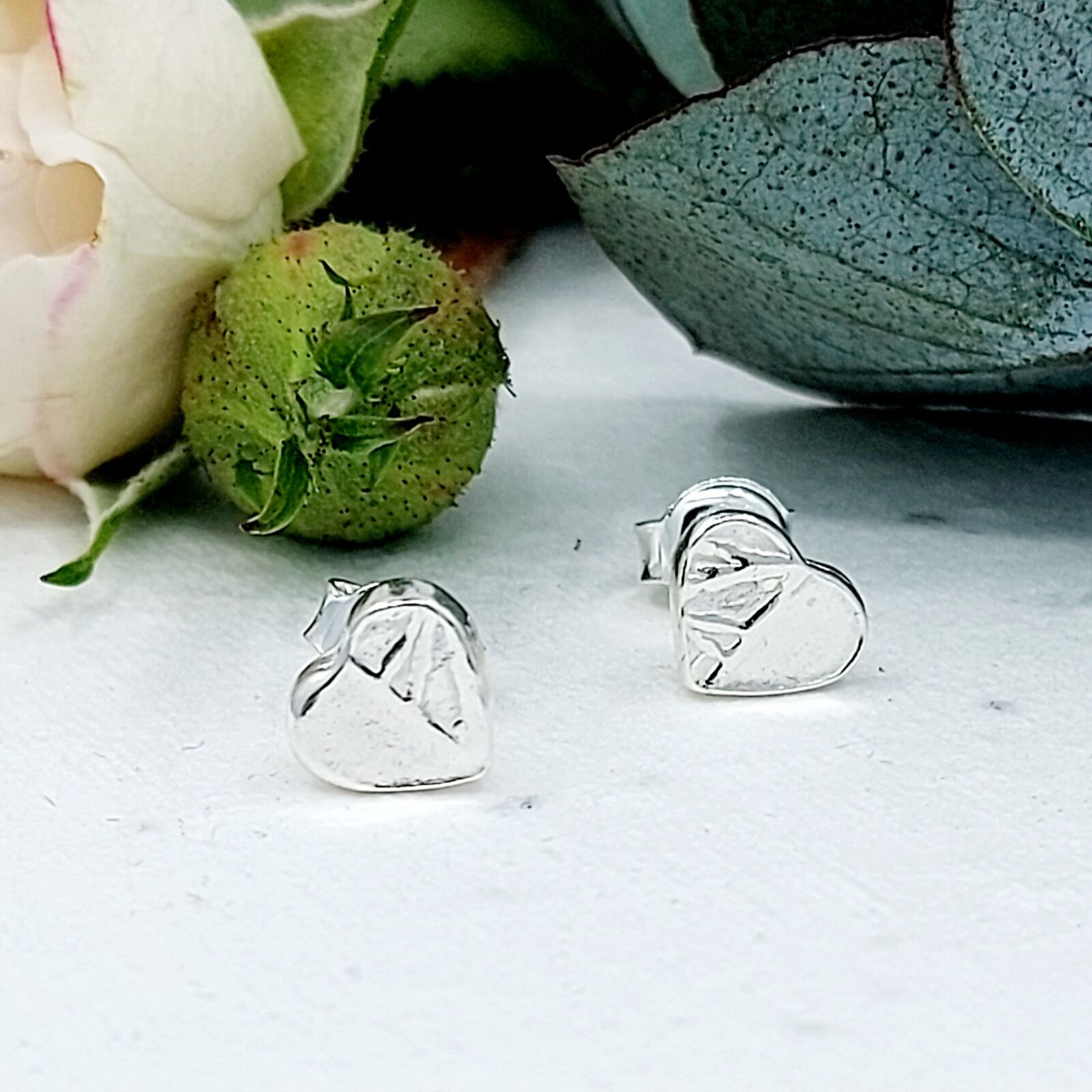 Very cute handmade silver 'Ice; heart stud earrings.