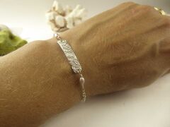 Floral,Volutes,Name,Tag,Bracelet,in,Sterling,silver,floral silver bracelet, designer jewelry, silver tag bracelet, jewellery in London, catherine marche, french design, flowers, volutes, engraved silver